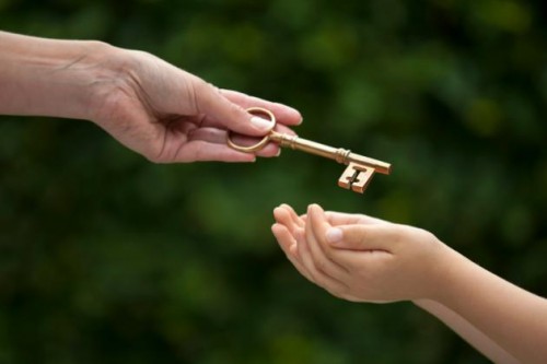 adult hands key to child